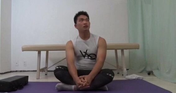 Watch this Asian boy stretch and jerk off his way to orgasm
